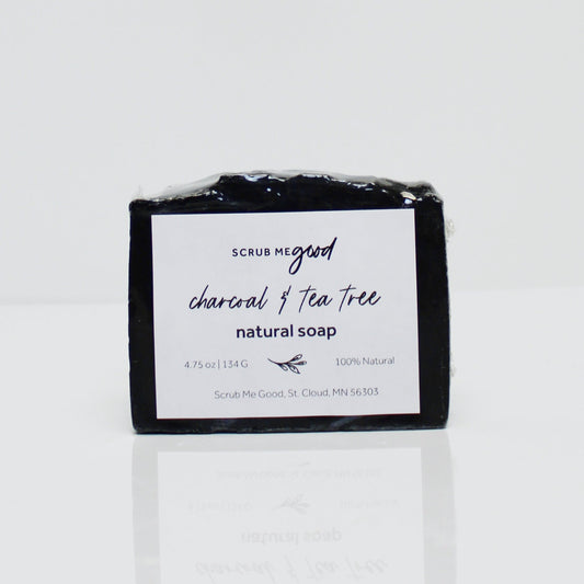 Close-up of charcoal and tea tree soap bar for men