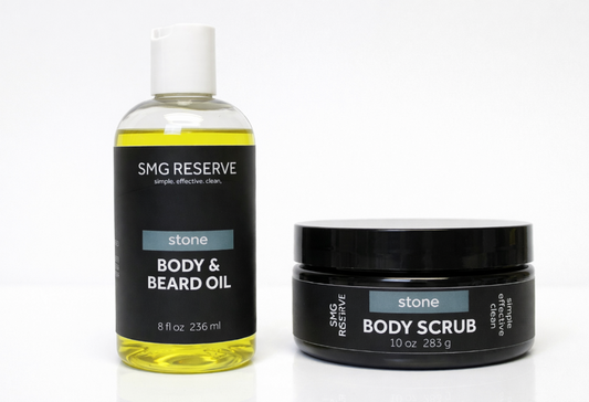 SMG Reserve Stone body scrub and body and beard oil shown side by side on a white background, featuring a men’s exfoliating scrub and lightweight grooming oil