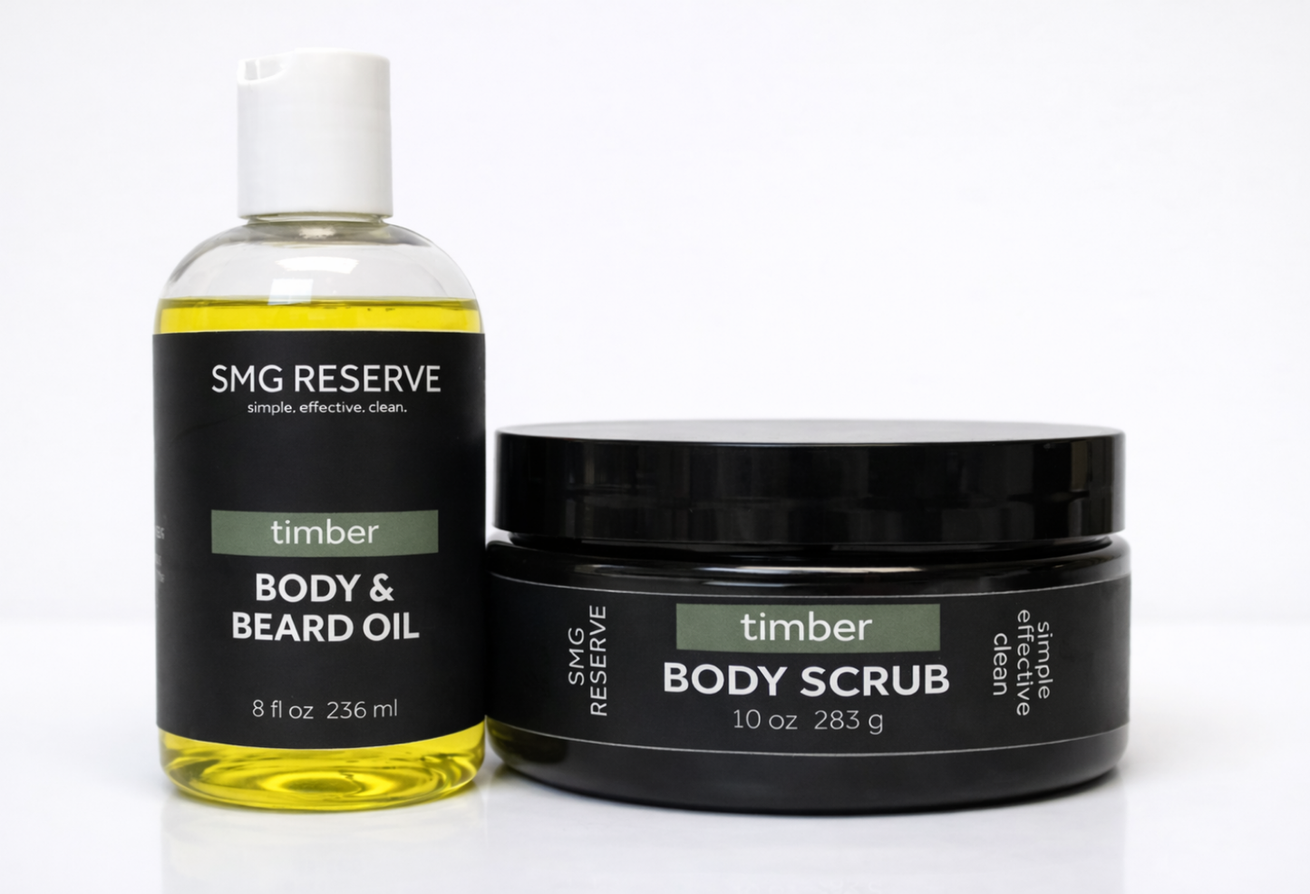 SMG Reserve Timber body scrub and body and beard oil shown side by side on a white background, featuring a men’s exfoliating scrub and lightweight grooming oil
