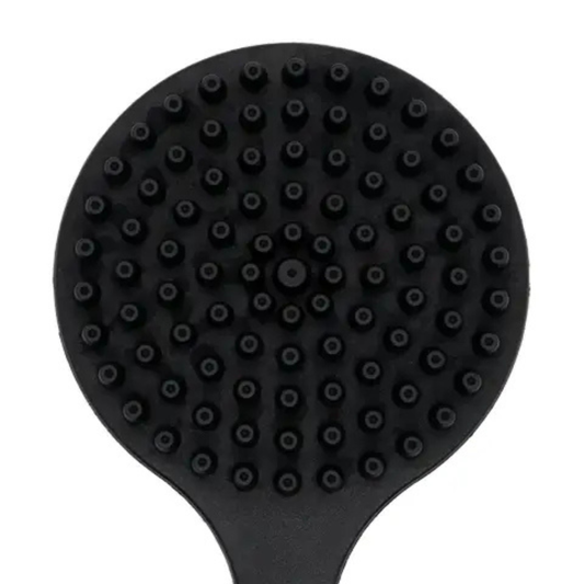 Close-up of black back scrubber brush head with short, rounded bristles